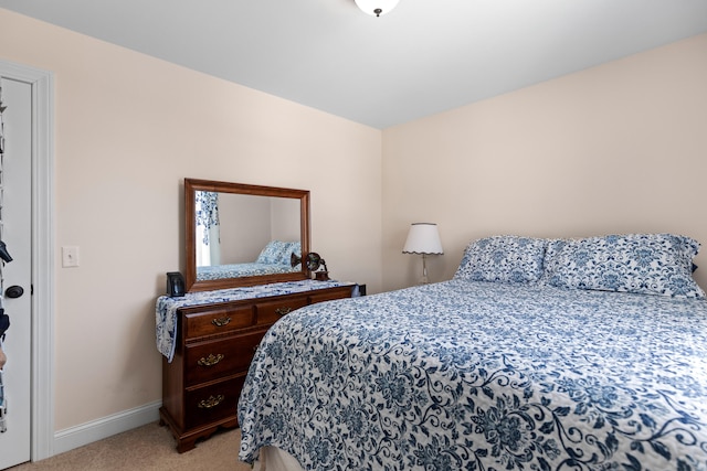 bedroom featuring light colored carpet