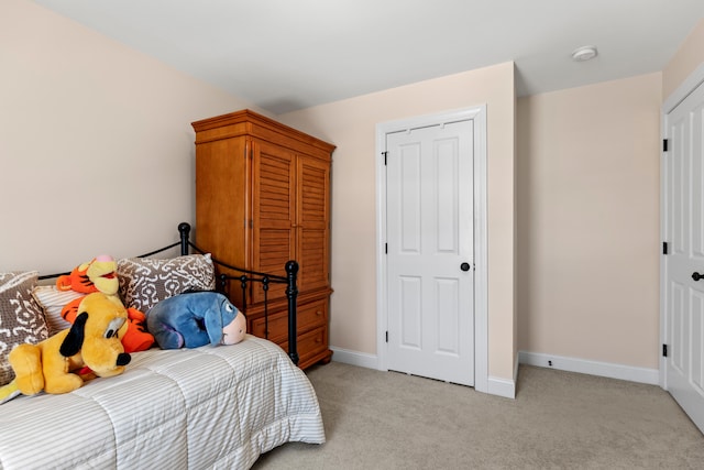 bedroom with light colored carpet