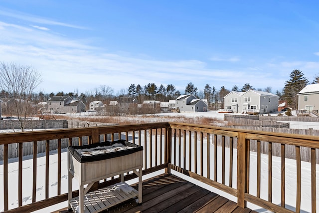 view of snow covered deck