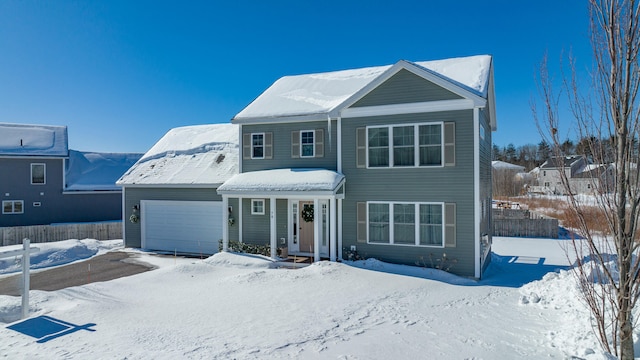 front of property with a garage