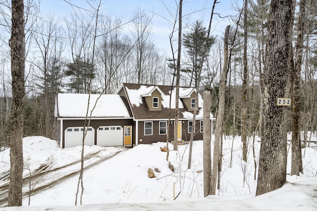 cape cod-style house with a garage