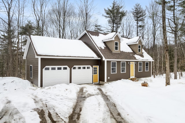 new england style home with a garage