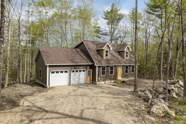 232 Bond Spring Rd, Newfield, ME 04095 - view of front of house featuring a garage, asphalt driveway, and a shingled roof