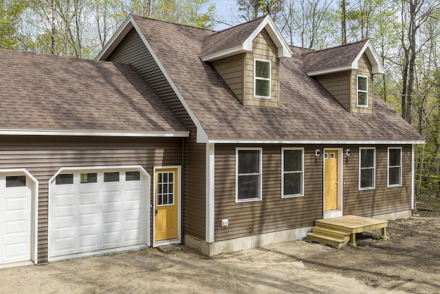 232 Bond Spring Rd, Newfield, ME 04095 - view of front of home featuring roof with shingles, asphalt driveway, and a garage