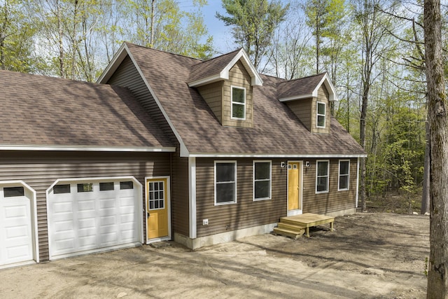 232 Bond Spring Rd, Newfield, ME 04095 - view of front of home with driveway, a shingled roof, and a garage