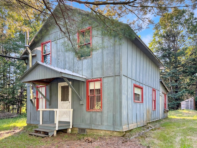 6049 Arnold Trl, Coburn Gore, ME 04936 - view of front of property with board and batten siding