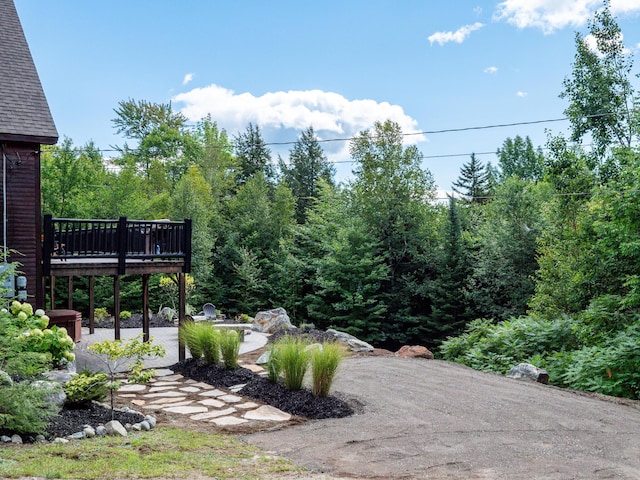 view of yard with a deck and a patio area