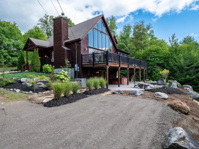 exterior space featuring a patio and a wooden deck