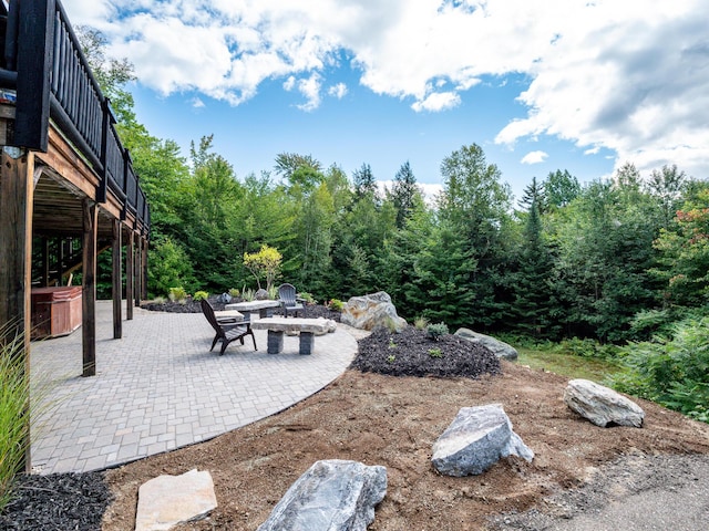 view of yard with a patio and a fire pit