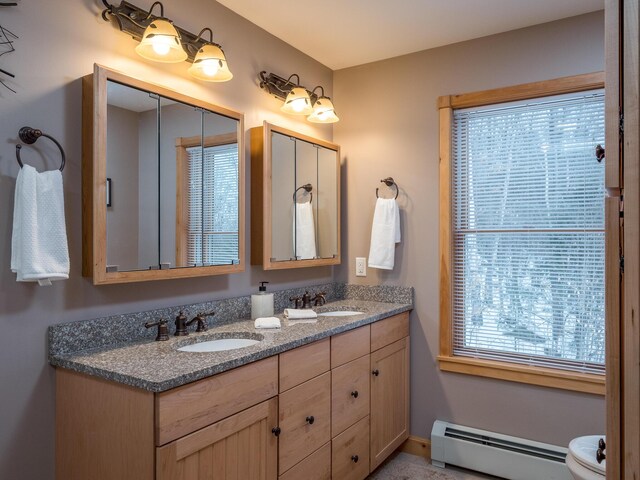 bathroom with a baseboard radiator and vanity