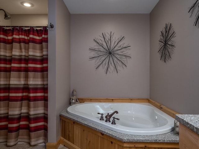 bathroom featuring a tub and vanity