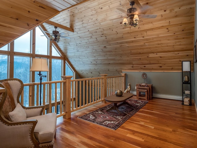 living area with hardwood / wood-style floors, ceiling fan, a baseboard heating unit, and wood ceiling