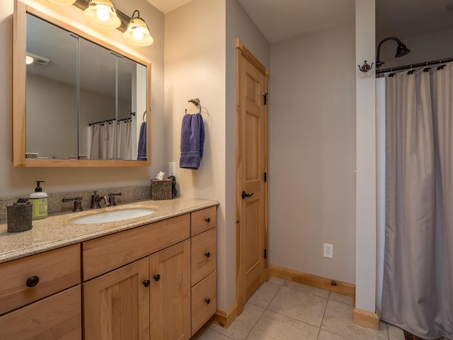 bathroom featuring vanity and tile patterned flooring