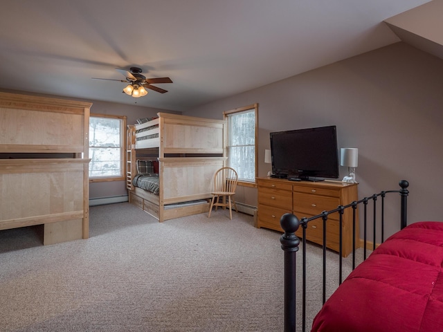 carpeted bedroom featuring vaulted ceiling, ceiling fan, and a baseboard radiator