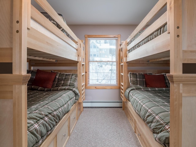 carpeted bedroom featuring baseboard heating