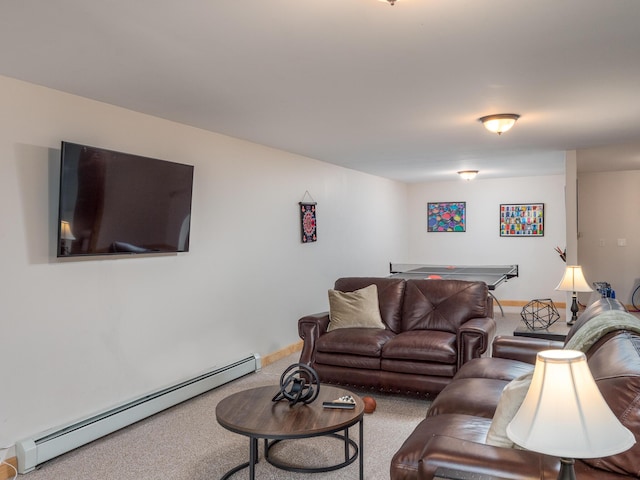 carpeted living room with a baseboard heating unit