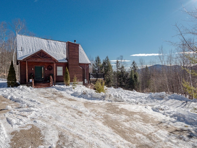 view of snowy exterior with a mountain view