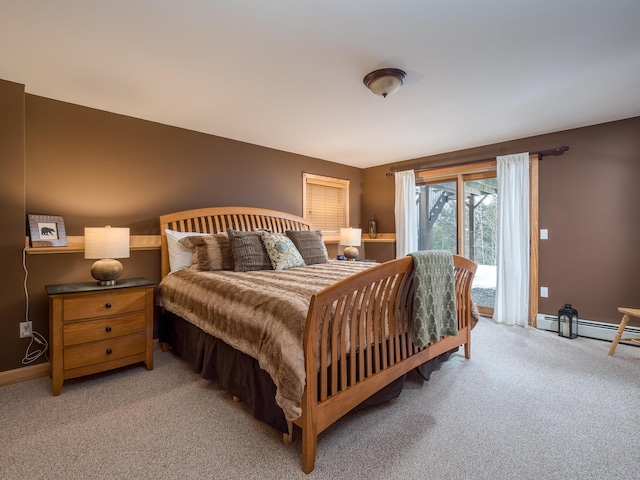 carpeted bedroom featuring a baseboard heating unit and access to outside