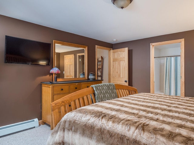 bedroom featuring carpet and a baseboard heating unit