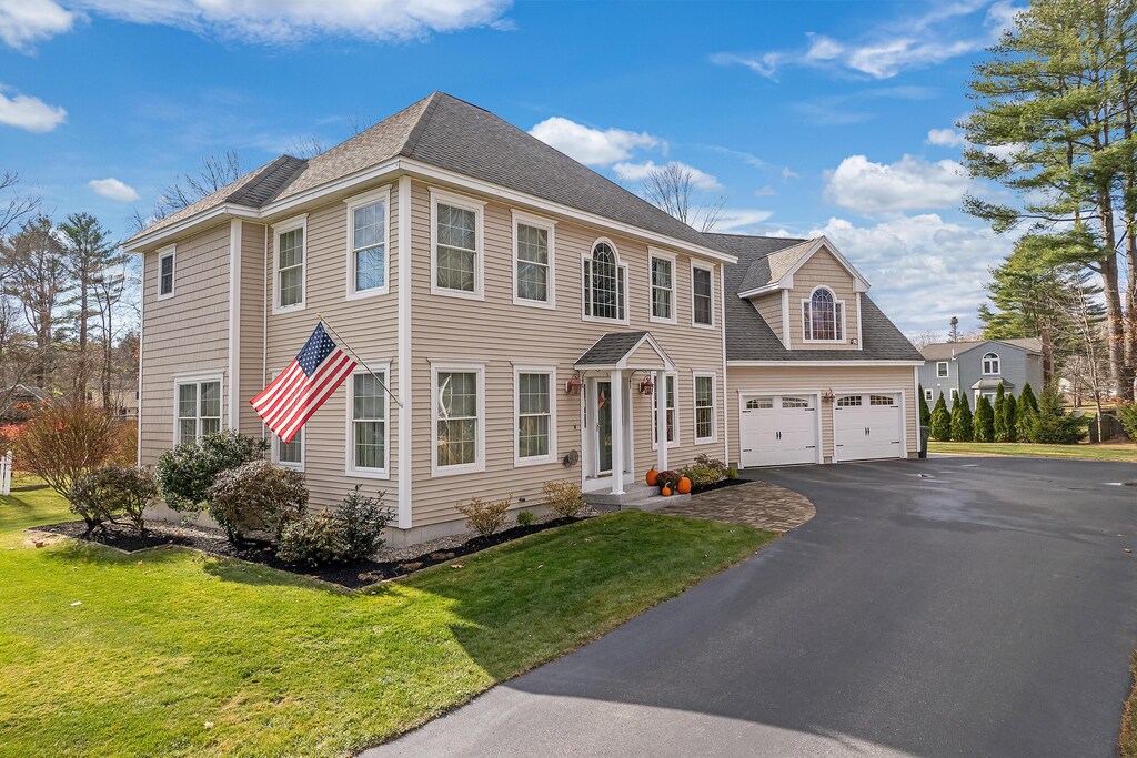 5 Buckthorn Cir, Saco, ME 04072 - colonial house with a garage, roof with shingles, driveway, and a front lawn