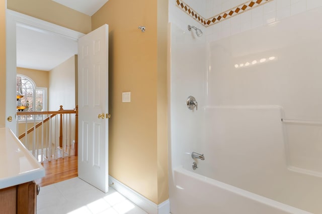 full bathroom with baseboards and shower / bathtub combination