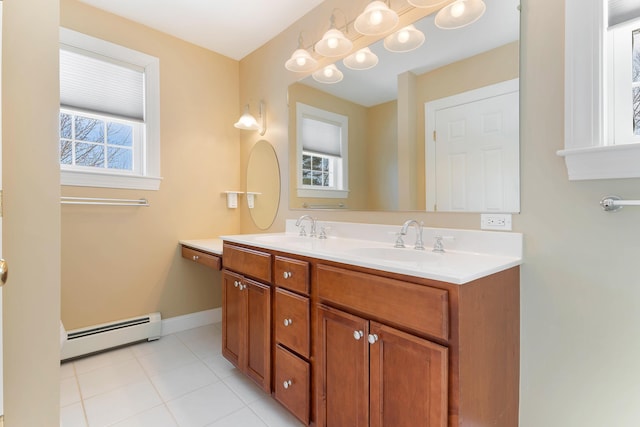 full bath with double vanity, baseboards, baseboard heating, and a sink