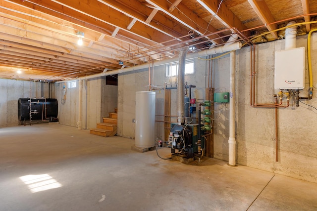 basement featuring a heating unit, stairway, heating fuel, tankless water heater, and gas water heater