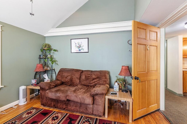 living room featuring hardwood / wood-style floors and lofted ceiling