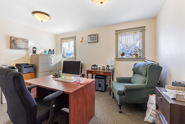 home office with light colored carpet and a wall mounted AC