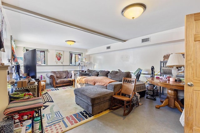 living room featuring concrete flooring