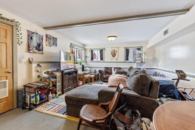 living room with beam ceiling