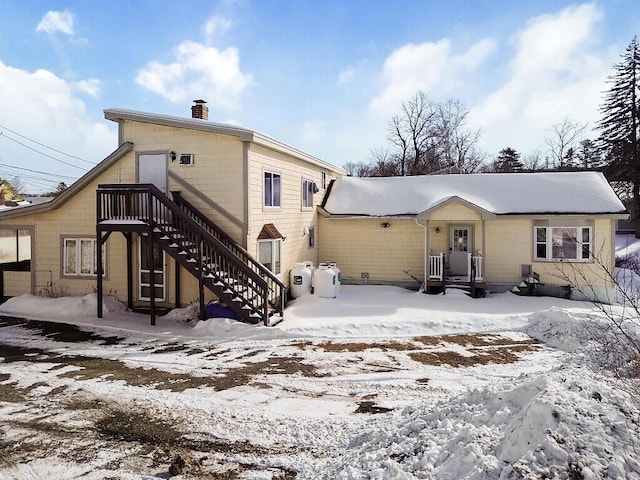 view of snow covered house