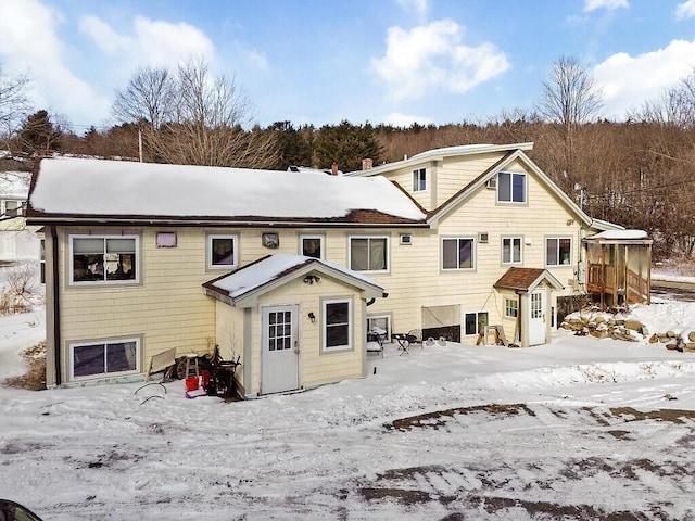 view of snow covered house