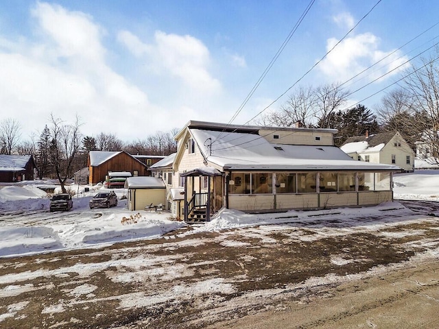 view of front of property with a sunroom