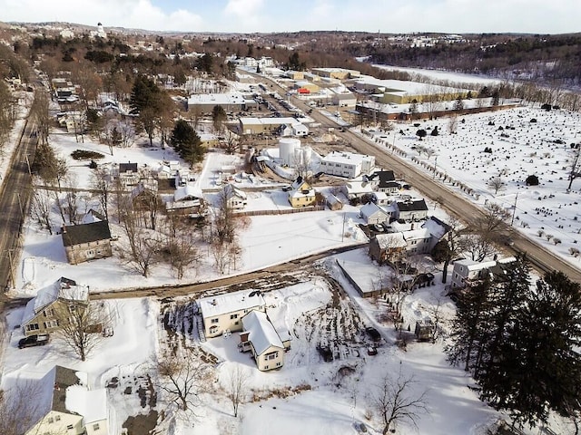 snowy aerial view featuring a residential view