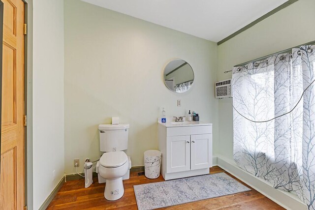 6 Stoddard Ln, Hallowell, ME 04347 - bathroom featuring wood finished floors, vanity, and a wall mounted air conditioner
