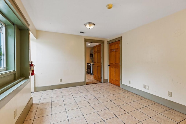 6 Stoddard Ln, Hallowell, ME 04347 - empty room featuring light tile patterned floors and a smoke detector