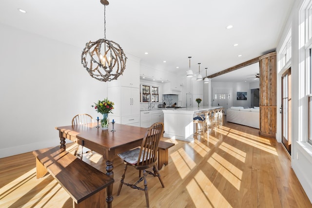 dining space featuring recessed lighting, light wood-style flooring, and baseboards