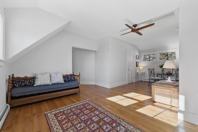 living room with lofted ceiling, a baseboard radiator, ceiling fan, and wood finished floors