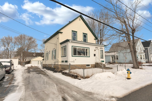 view of front facade with an outbuilding and a garage