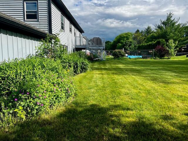 view of yard featuring stairway