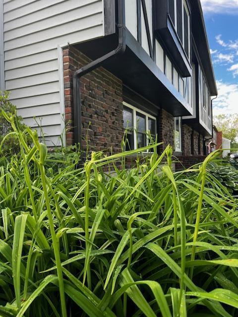 view of home's exterior with brick siding