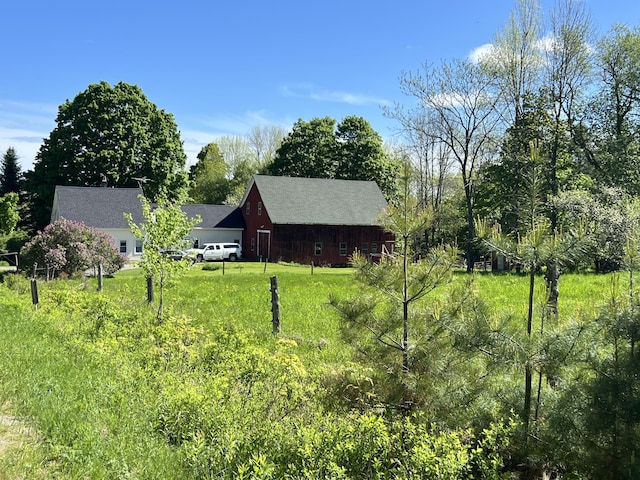 96 Exeter Rd, Garland, ME 04939 - view of grassy yard featuring an outdoor structure and view of scattered trees