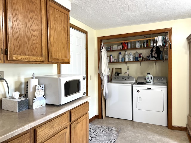 96 Exeter Rd, Garland, ME 04939 - washroom with washing machine and clothes dryer, baseboards, and a textured ceiling