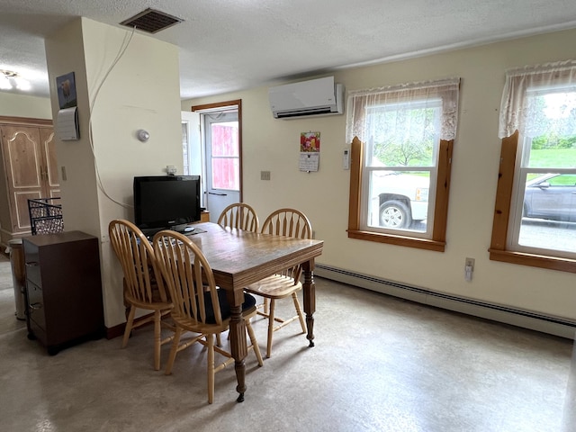96 Exeter Rd, Garland, ME 04939 - dining space with a baseboard heating unit, a wall unit AC, plenty of natural light, and a textured ceiling