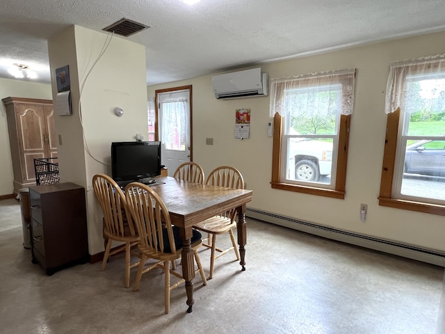 96 Exeter Rd, Garland, ME 04939 - dining area featuring an AC wall unit, a baseboard radiator, and a textured ceiling