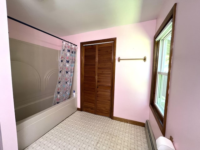 96 Exeter Rd, Garland, ME 04939 - bathroom with baseboard heating, shower / bath combo with shower curtain, baseboards, and a closet