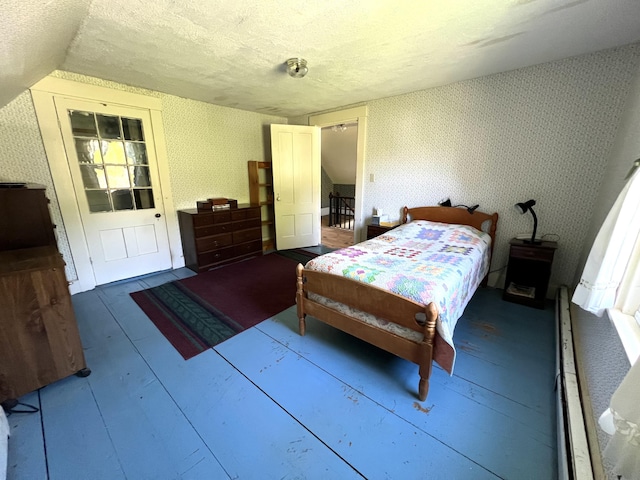 96 Exeter Rd, Garland, ME 04939 - bedroom with wallpapered walls, a textured ceiling, and lofted ceiling