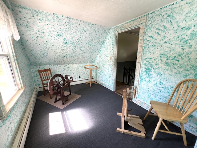 96 Exeter Rd, Garland, ME 04939 - sitting room with wallpapered walls, a textured ceiling, an upstairs landing, lofted ceiling, and carpet floors