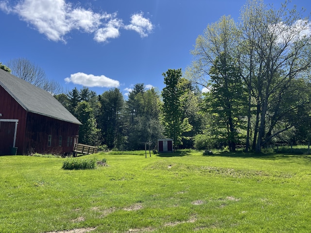 96 Exeter Rd, Garland, ME 04939 - view of green lawn with an outbuilding